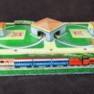 Tin wind up toy dual miniature trains plastic bridge works no key or markings