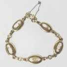 Cameo bracelet oval links with lady on light brown background 7 1/2" gold tone Cameo bracelet oval links with lady on light brown background 7 1/2" gold tone