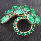 Vintage pin green pronged rhinestones & carbochon specked stones