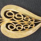 Monet heart shaped leaf pin gold tone tooled edges open scroll center