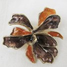 Sarah Coventry enamel pin pendant black orange flower