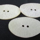 3 oval textured buttons curved beige vintage 2 x 1 1/4"