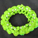 Lucite plastic flower stretch bracelet UV glow green yellow white beads vintage