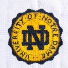 Notre Dame logo finished cross stitched pillow top or picture on white fabric Notre Dame logo finished cross stitched pillow top or picture on white fabric