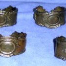 Six heavy metallic napkin rings