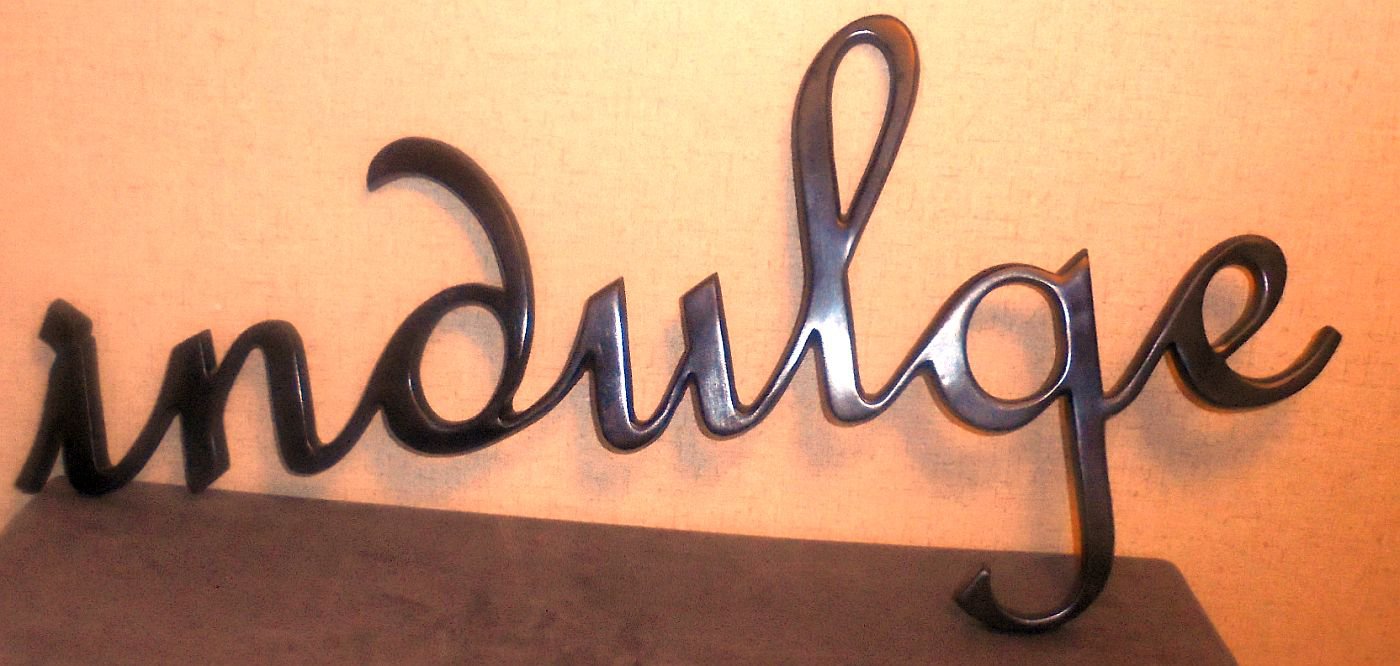 Heavy cast iron Indulgence Logo