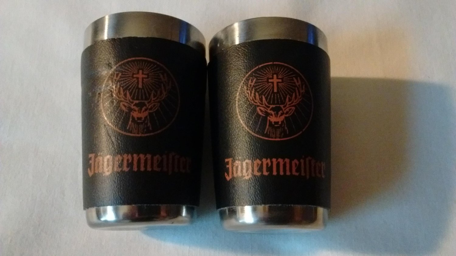J&Atilde;�GERMEISTER Shot Glass Set of 2 Stainless with Orange Logo on Faux Black Wrap
