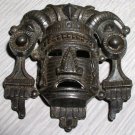 Vintage primitive cast mask brooch
