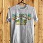 SIZE 4XL PLAYING IN THE SAND FESTIVAL LOGO FRONT SIDE WHITE TEE SHIRT