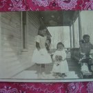 Vintage Photographic Postcard- 3 girls with dolls