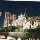 Notre Dame at night Paris France vintage postcard