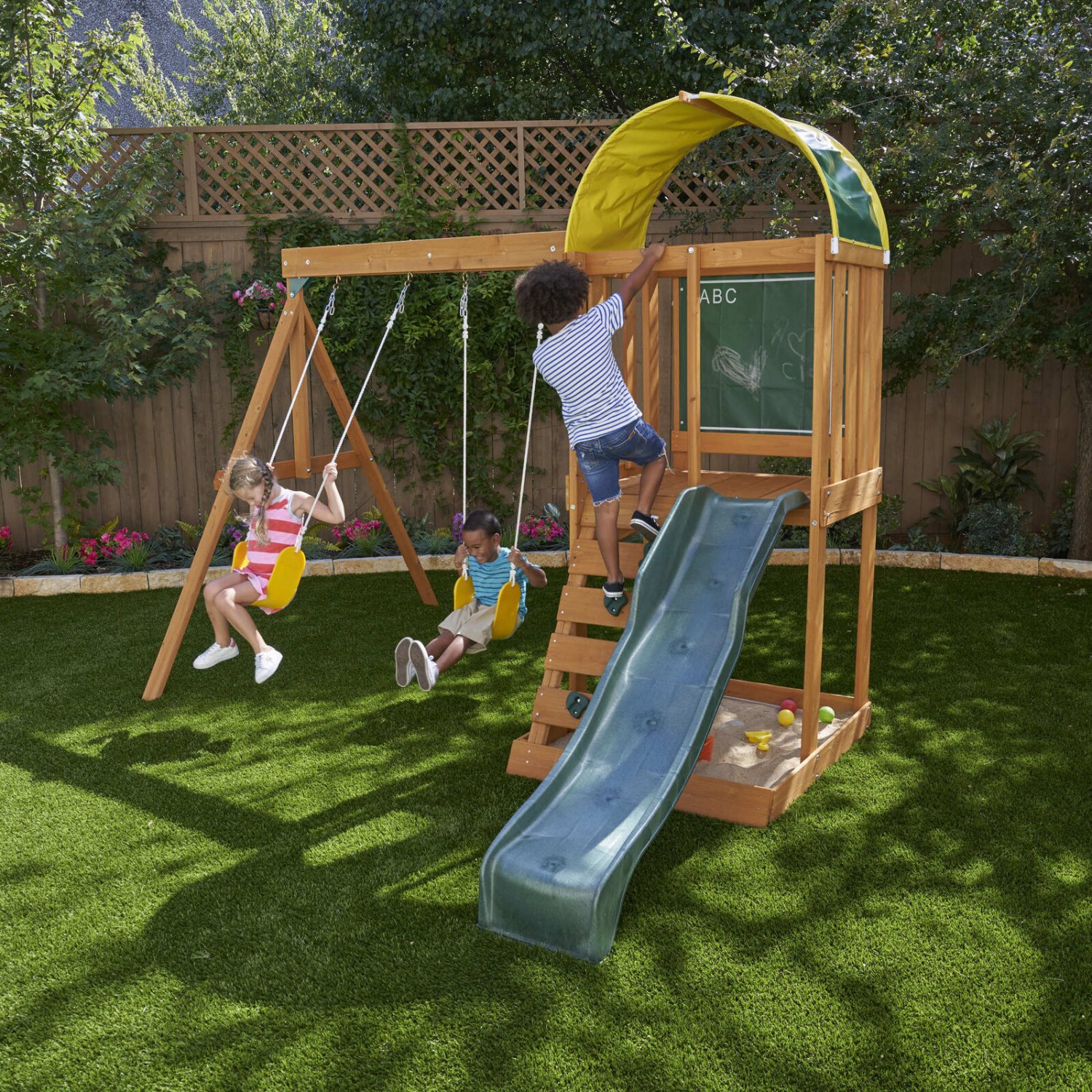KidKraft Ainsley Wooden Outdoor Swing Set with Slide, Chalk Wall