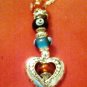 Awesome detail on this special 16 inch silvertone necklace with colored beads