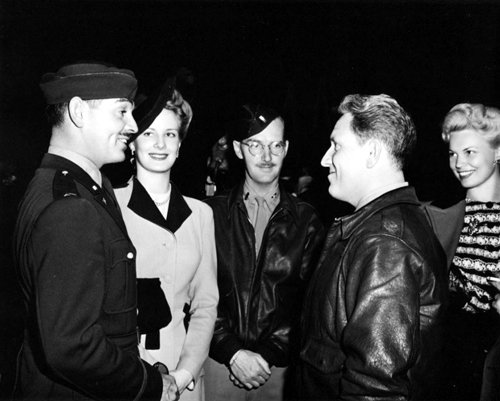 Clark Gable and Spencer Tracy Talk Helen O Hara, Unknown, and Bunny Waters look on, 1943 Photo