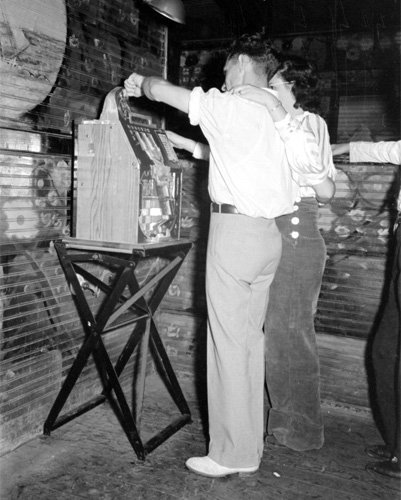 Couple Playing Slot Machine, Raceland, Louisiana 1938 Photo