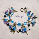 Loaded Flower Glass Silver Cat's Eye Charm Bracelet Loaded Flower Glass Silver Cat's Eye Charm Bracelet