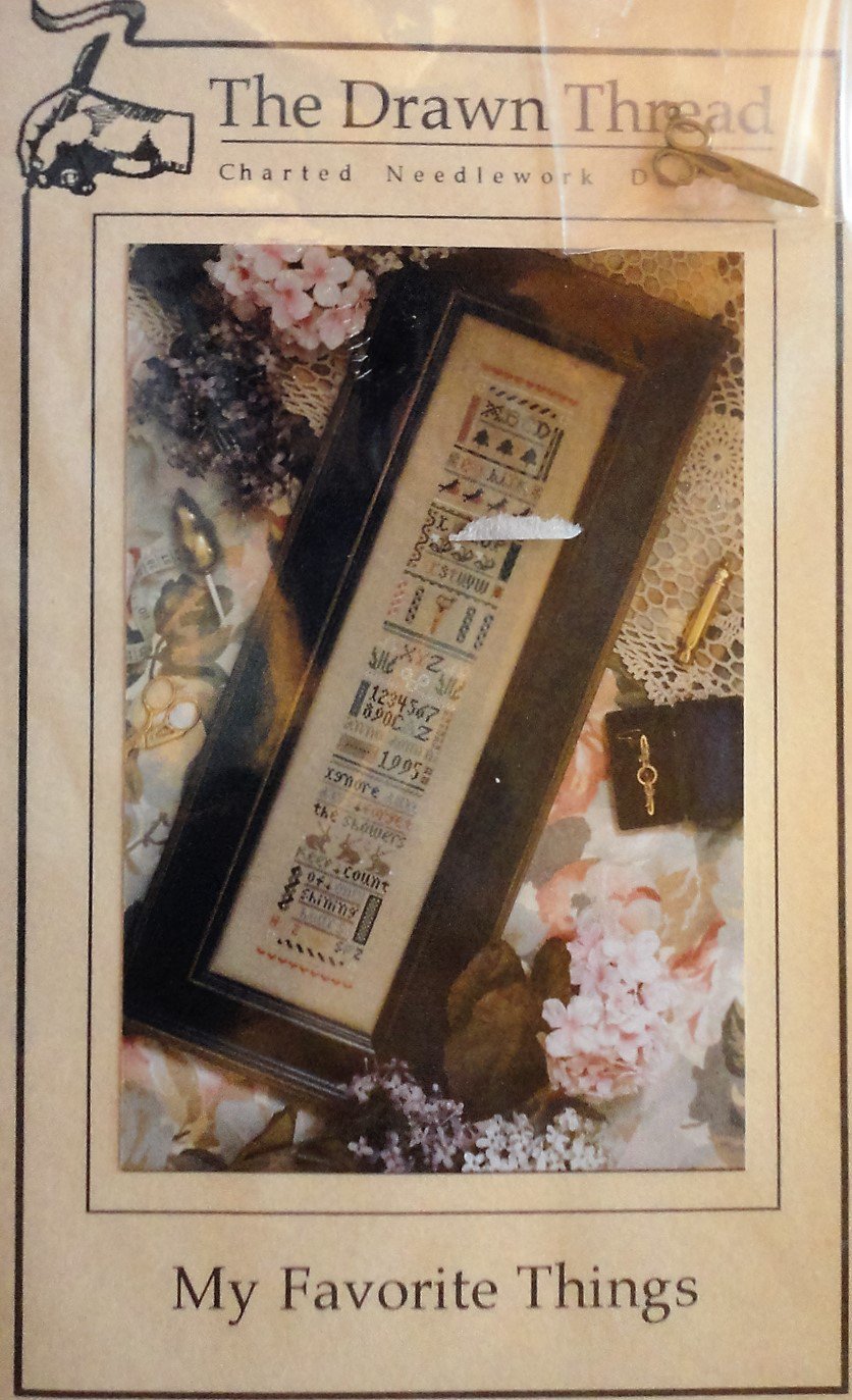 The Drawn Thread Sampler cross stitch chart My Favorite Things includes scissor charm and buttons.