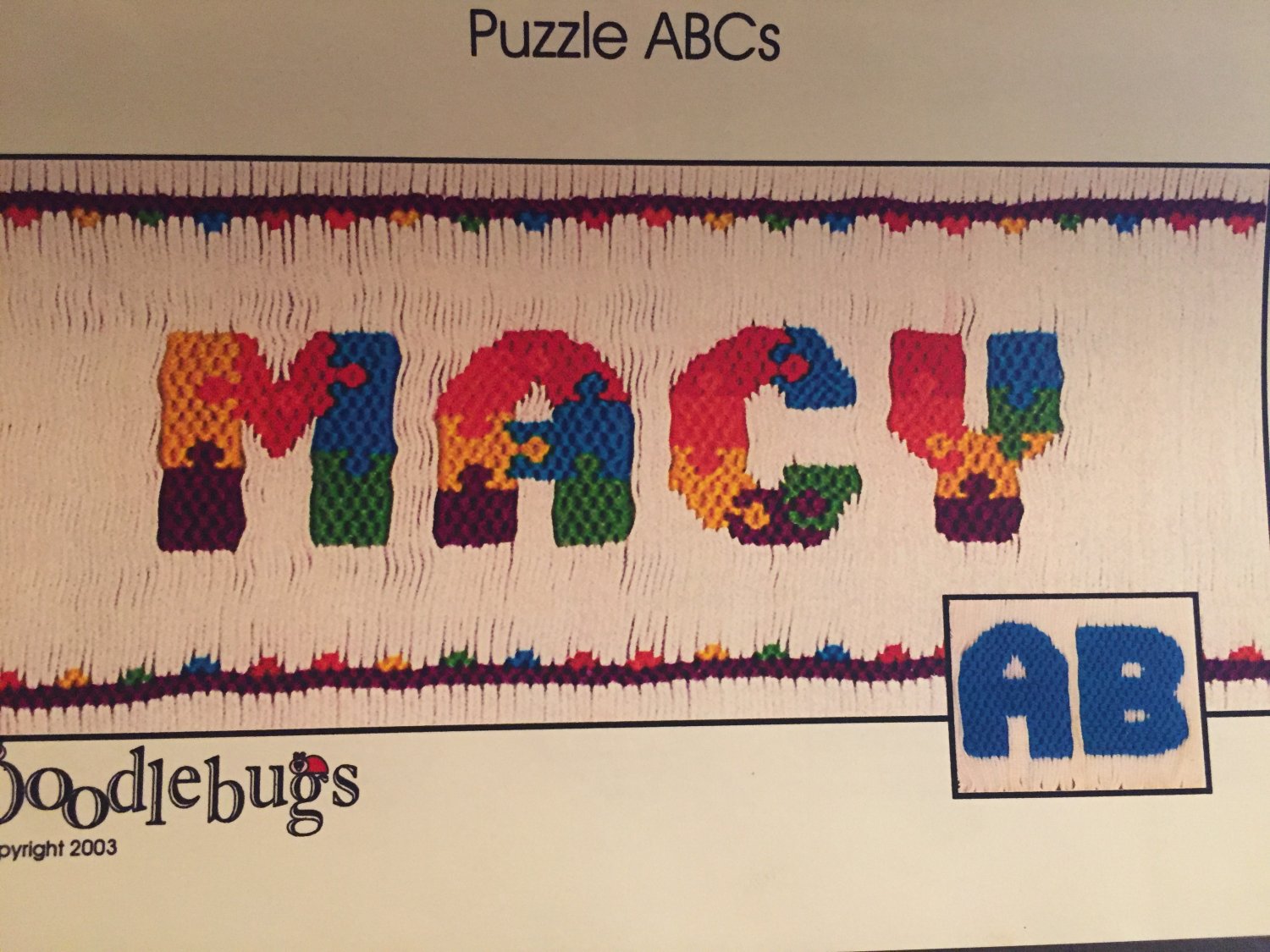 Puzzle ABCs Smocking plate from Doodlebugs