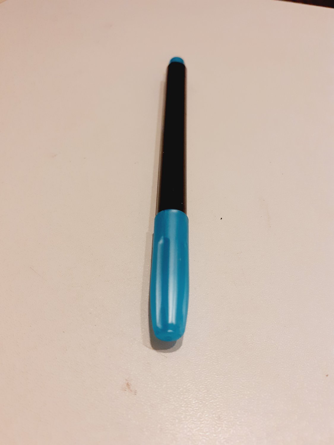 turquoise textile marker pen