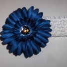 Deep Blue Gerbera Daisy hair clip on a white 1.5 inch crochet headband