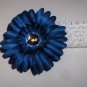 Deep Blue Gerbera Daisy hair clip on a white 1.5 inch crochet headband