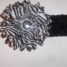 Zebra 4 inch gerbera daisy on a black 1.5 inch crochet headband