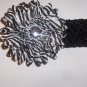 Zebra 4 inch gerbera daisy on a black 1.5 inch crochet headband