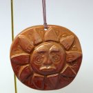 The Earth Shop Christmas ornament handmade clay sun face