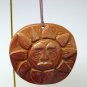 The Earth Shop Christmas ornament handmade clay sun face