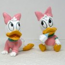 2 Disney Daisy Duck Baby figurines crawling and holding a baby bottle made by CAR 2 Disney Daisy Duck Baby figurines crawling and holding a baby bottle made by CAR