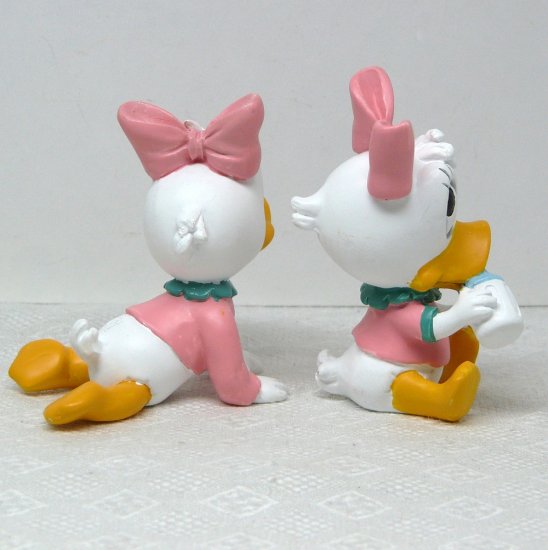 2 Disney Daisy Duck Baby figurines crawling and holding a baby bottle ...