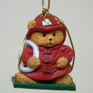 Christmas ornament Avon Holiday Package Topper Fireman 1997