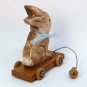 tan sitting bunny pull toy decoration hand carved wood artist signed 2001