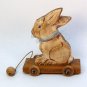 tan sitting bunny pull toy decoration hand carved wood artist signed 2001