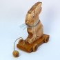 tan sitting bunny pull toy decoration hand carved wood artist signed 2001