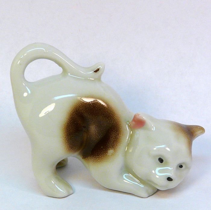 Vintage playful cat figurine made in Japan porcelain