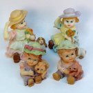 4 figurines of children small resin hand painted