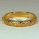 vtg Monet cuff bracelet hinged engraved leaves gold tone