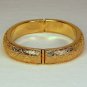vtg Monet cuff bracelet hinged engraved leaves gold tone