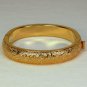 vtg Monet cuff bracelet hinged engraved leaves gold tone