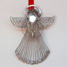 Silver tone filigree angel Christmas ornament Silver tone filigree angel Christmas ornament