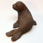 Red Mill Mfg seal figurine pecan shells dark brown