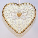 plastic heart shaped filigree Christmas ornament with flowers leaves and deer plastic heart shaped filigree Christmas ornament with flowers leaves and deer