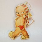Vtg Merrimack 1983 Kewpie Christmas ornament cardboard carrying an axe