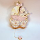 Vtg Kurt Adler girl baby in a carriage Christmas ornament wooden movable Vtg Kurt Adler girl baby in a carriage Christmas ornament wooden movable