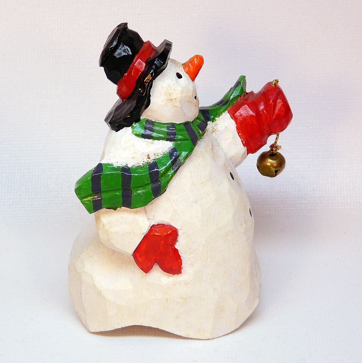 Vintage Dept 56 snowman holding a bell figurine