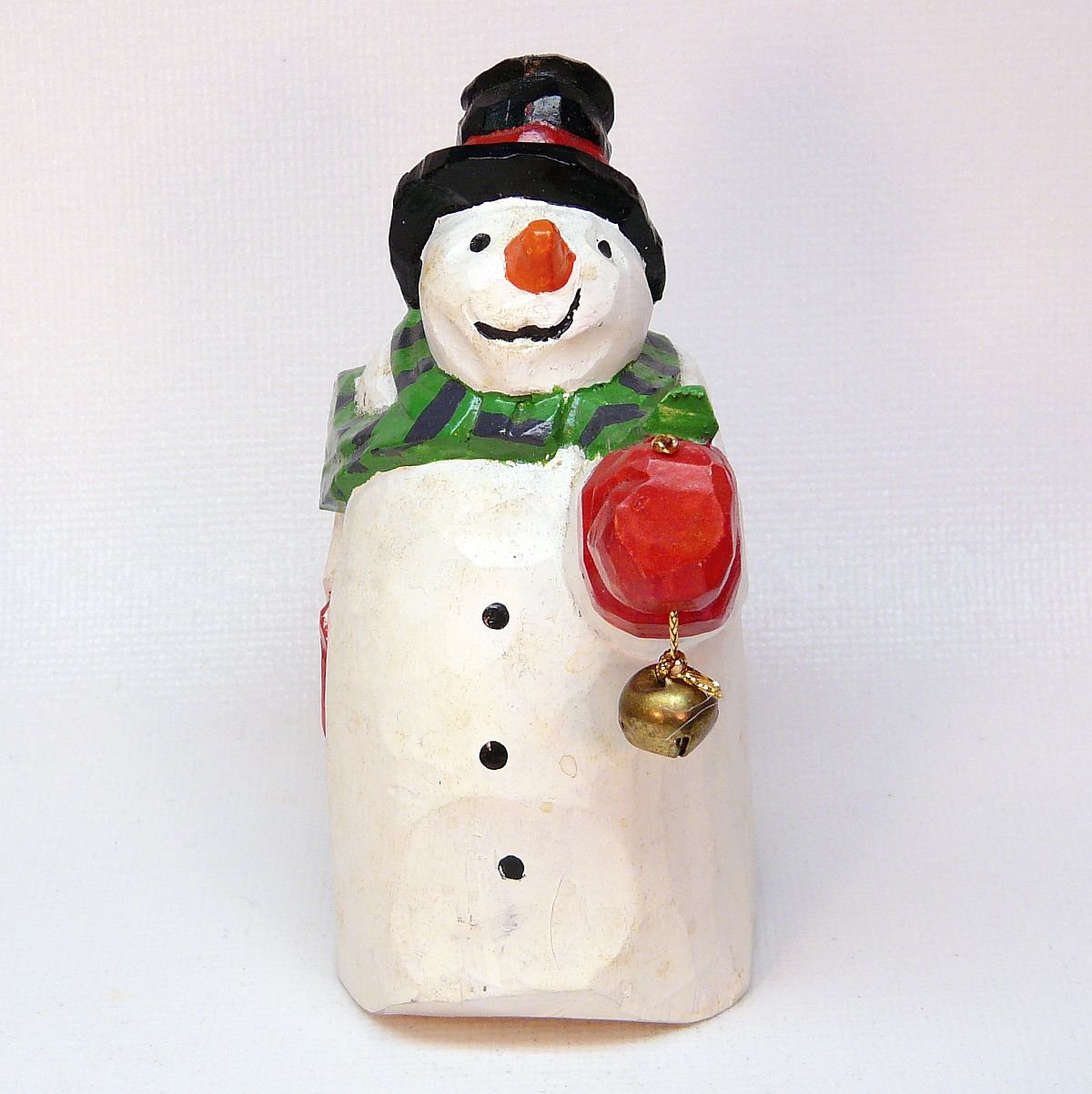 Vintage Dept 56 snowman holding a bell figurine