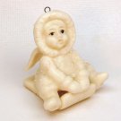 antique snow baby on sled Christmas ornament bisque porcelain