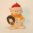 Snowman holding wreath Christmas ornament