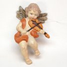 Vintage hard plastic cherub angel with violin Christmas ornament Vintage hard plastic cherub angel with violin Christmas ornament